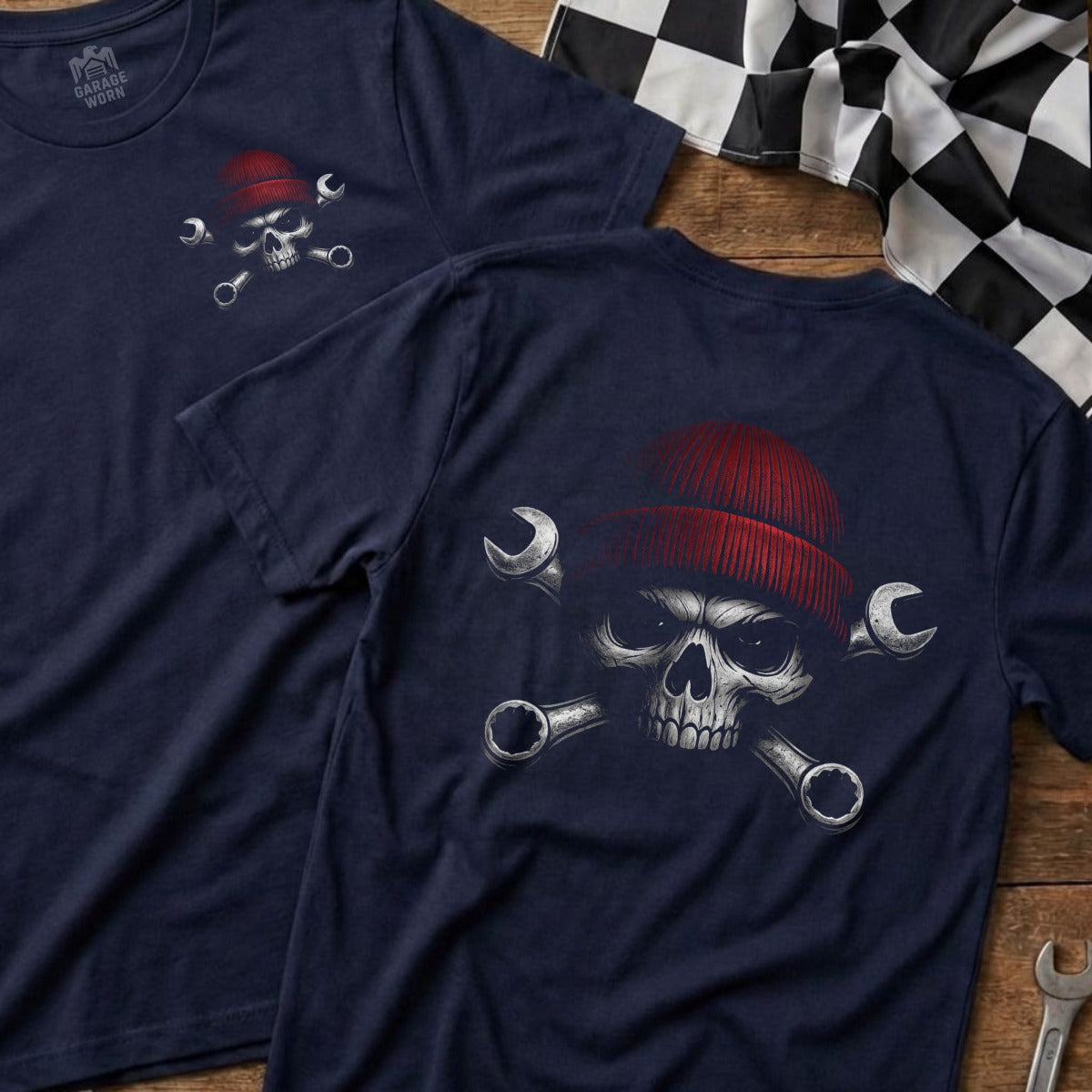 Navy t-shirt with skull, beanie, and crossed wrenches graphic on back.