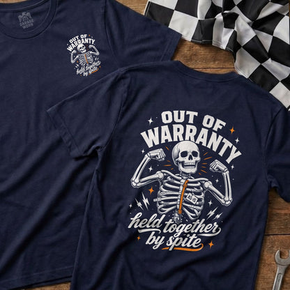 Navy t-shirt with skeleton graphic and text "Out of Warranty" and "Held Together By Spite".