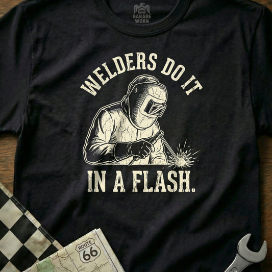T-shirt graphic of a welder with text "WELDERS DO IT IN A FLASH."