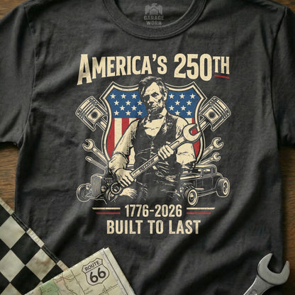 Abraham Lincoln on t-shirt with American flag, wrenches, and "America's 250th Built to Last."
