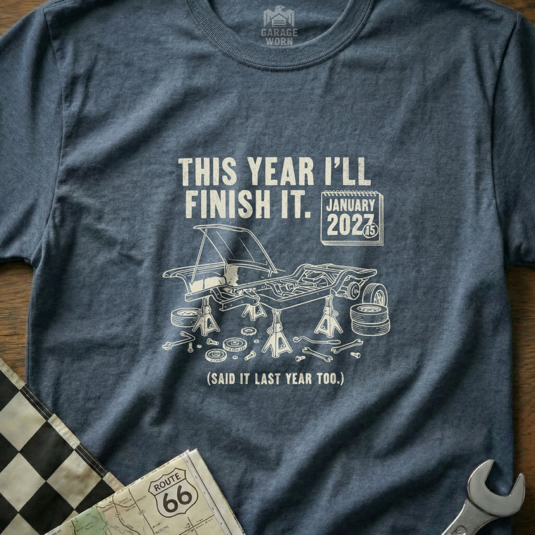 T-shirt with "This year I'll finish it. January 2027 (Said it last year too.)" text.
