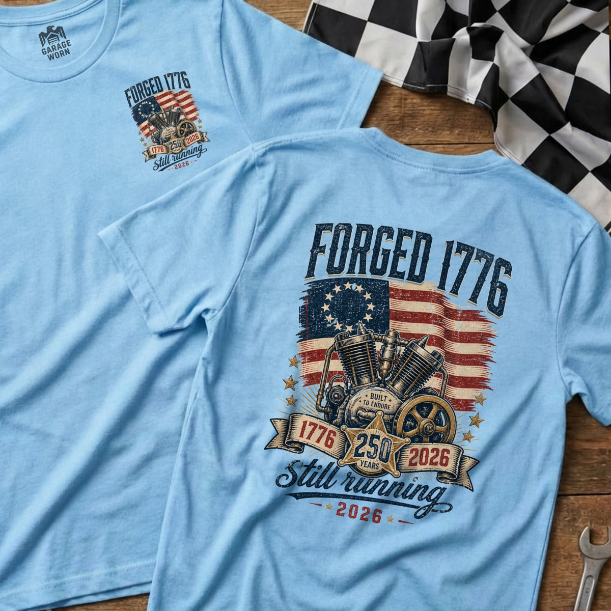 Light blue t-shirt with "FORGED 1776" and motorcycle engine graphic.