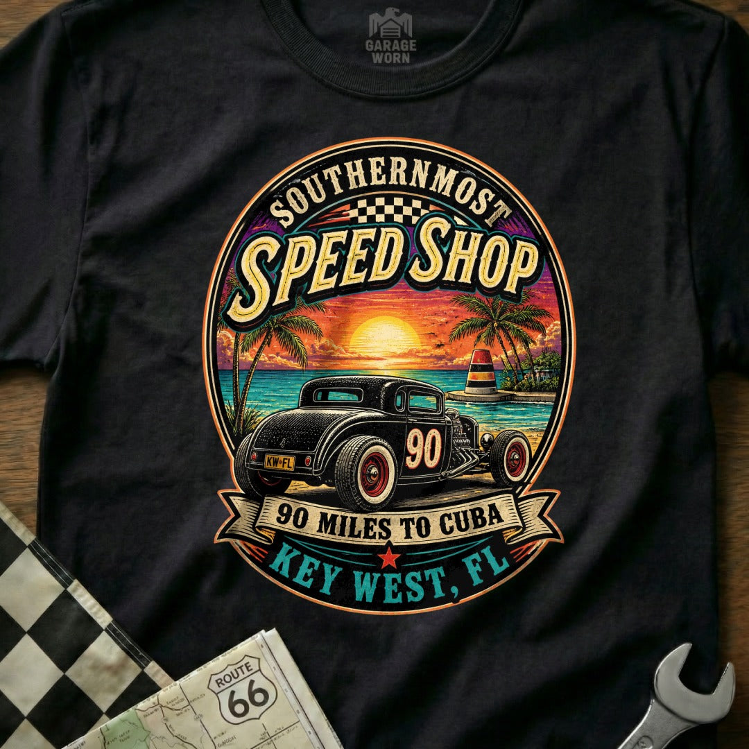 Black t-shirt graphic with vintage hot rod, sunset beach, and "Key West, FL" text.