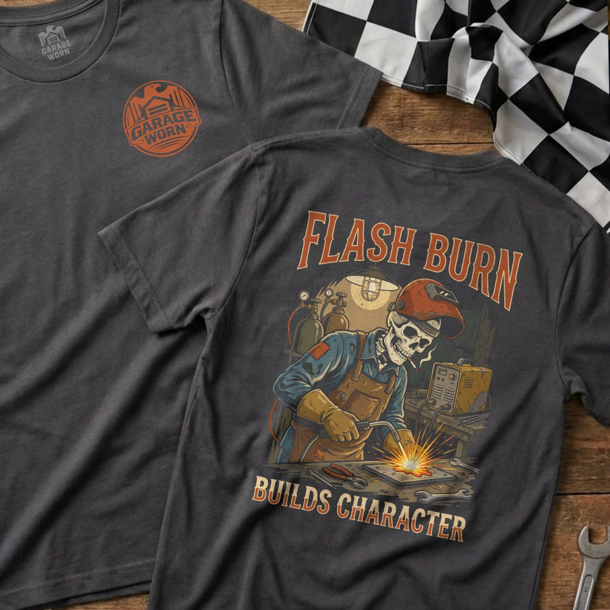 Dark t-shirt with "Flash Burn Builds Character" welding skeleton graphic.