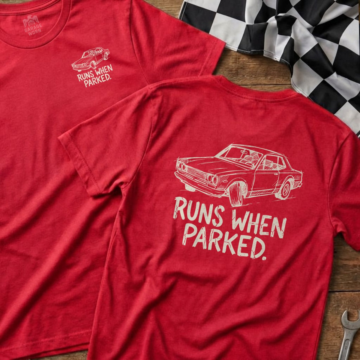 Red t-shirt with sketch of a car and "RUNS WHEN PARKED." text.