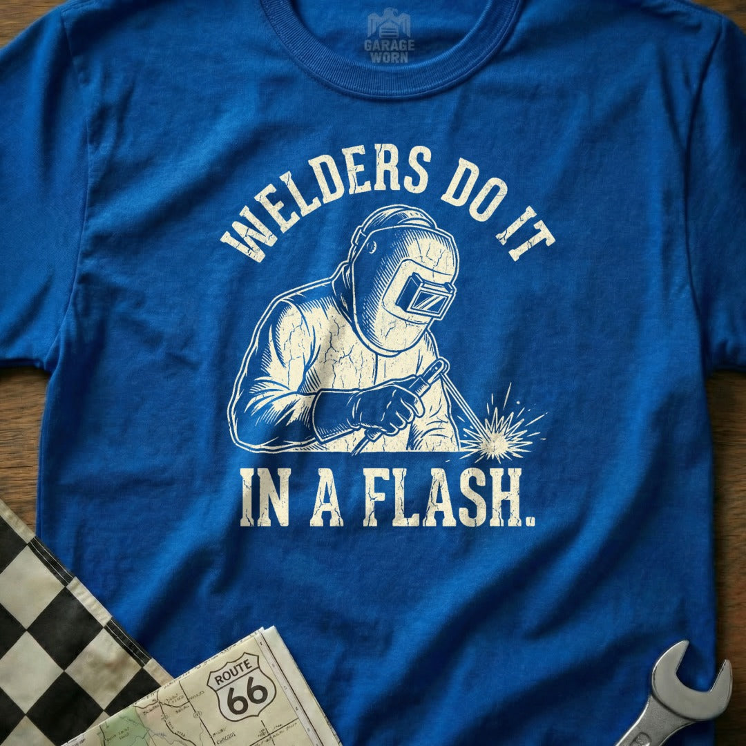 Blue t-shirt with welder graphic and text "WELDERS DO IT IN A FLASH."