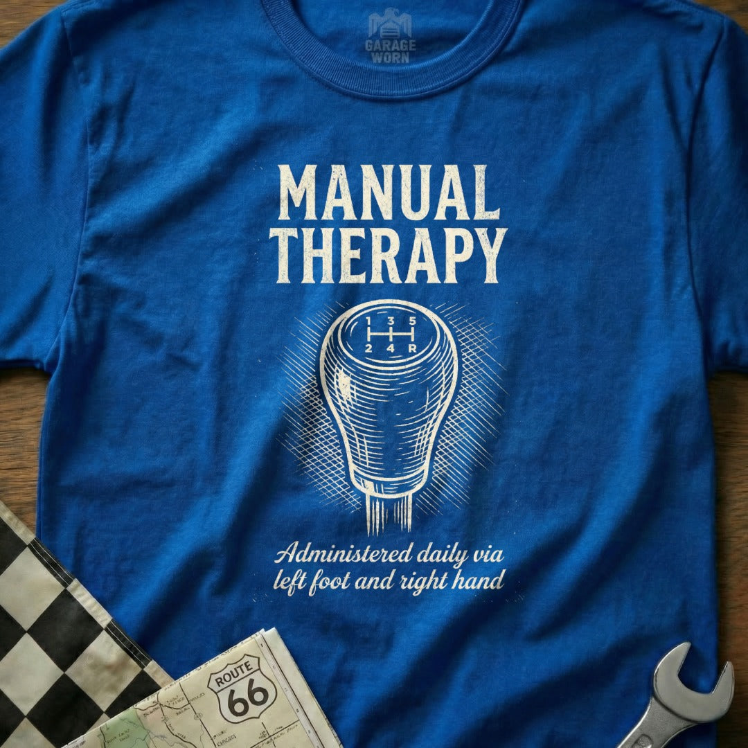 Blue t-shirt with "MANUAL THERAPY" and a gear shift graphic.