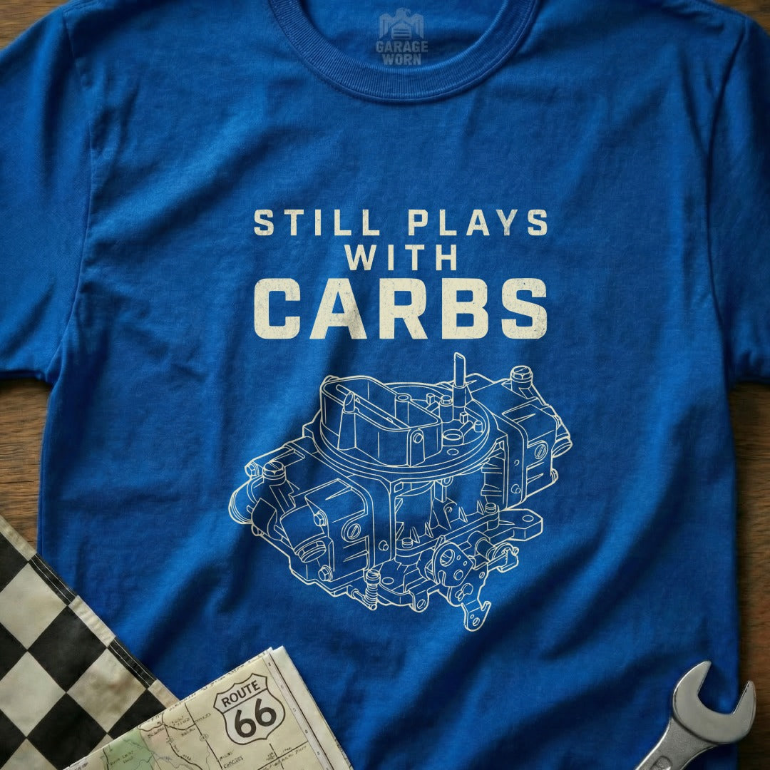 Blue t-shirt with a white diagram of a carburetor and "Still Plays With Carbs" text.