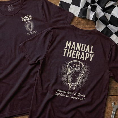 T-shirt with "Manual Therapy" text, gear shift graphic, and racing flag.