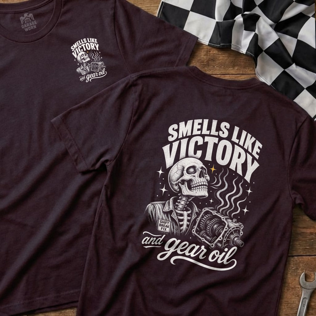 Dark t-shirt with skeleton, gearbox, and text "Smells Like Victory and Gear Oil".