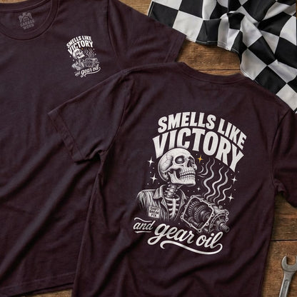 Dark t-shirt with skeleton, gearbox, and text "Smells Like Victory and Gear Oil".