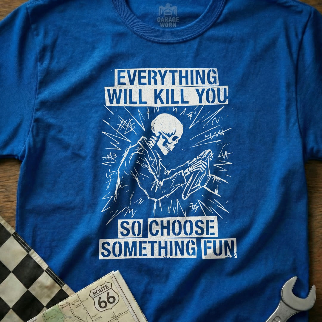 Blue t-shirt with skeleton driving and text "Everything Will Kill You So Choose Something Fun".