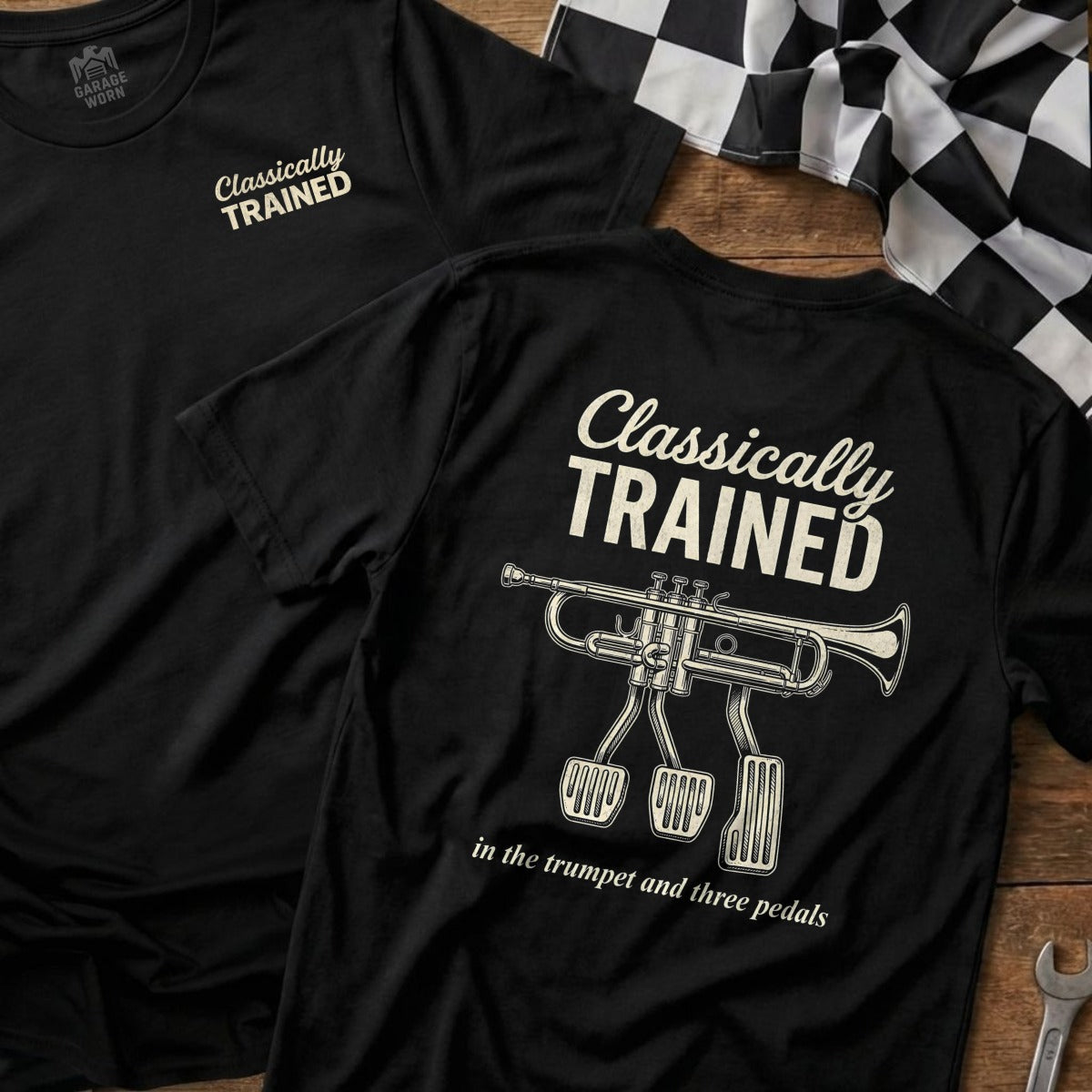 Black t-shirt with "Classically Trained" and trumpet with three pedals graphic.
