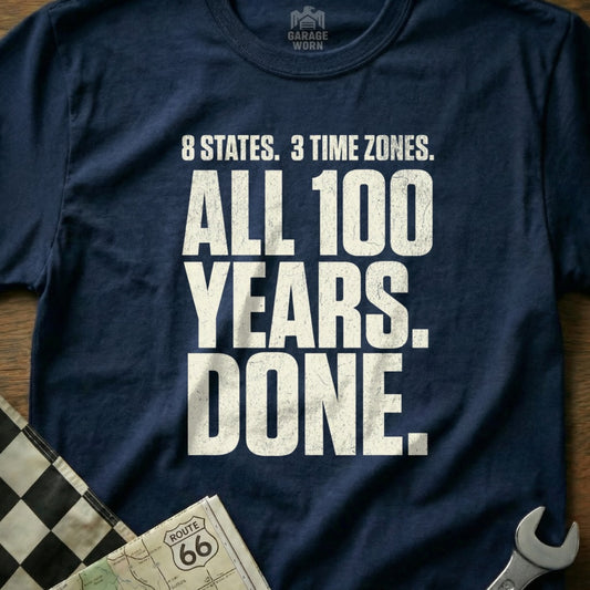 Navy t-shirt with "8 STATES. 3 TIME ZONES. ALL 100 YEARS. DONE." text.