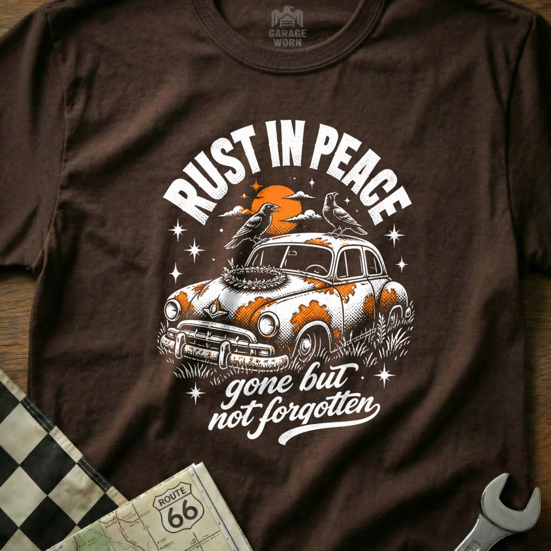 T-shirt graphic: RUST IN PEACE gone but not forgotten with rusted car and birds.