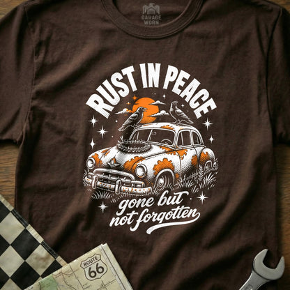 T-shirt graphic: RUST IN PEACE gone but not forgotten with rusted car and birds.