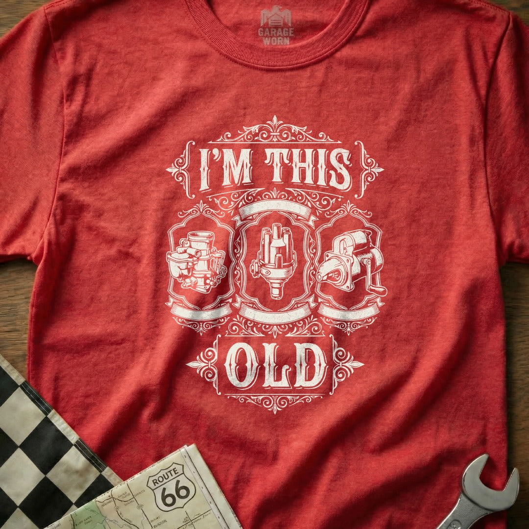 Red t-shirt with "I'm This Old" and vintage car parts graphic.