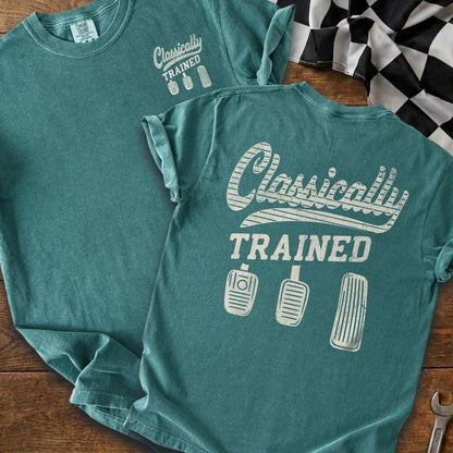 Teal t-shirt with "Classically TRAINED" and three pedal graphics.