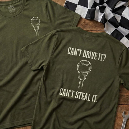 Olive green t-shirt with a shift knob graphic and text "Can't Drive It? Can't Steal It."