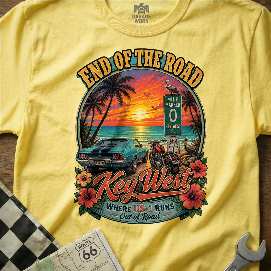 Yellow t-shirt graphic with Key West scene: car, motorcycle, sunset, palm trees, and text.
