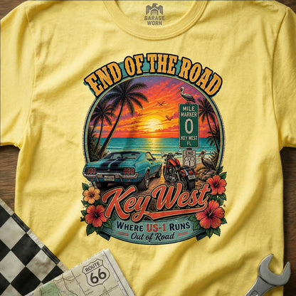 Yellow t-shirt graphic with Key West scene: car, motorcycle, sunset, palm trees, and text.