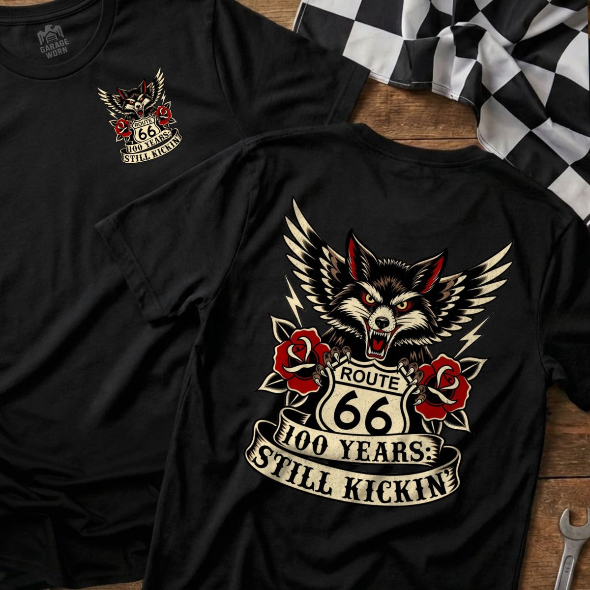 Black t-shirt with Route 66 wolf and roses graphic, "100 Years: Still Kickin".