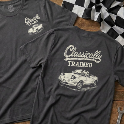 Dark grey t-shirt with white text "Classically TRAINED" and a drawing of a convertible.