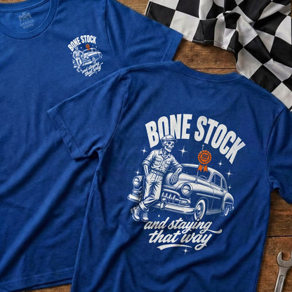 Blue t-shirt with skeleton leaning on classic car and text "BONE STOCK".