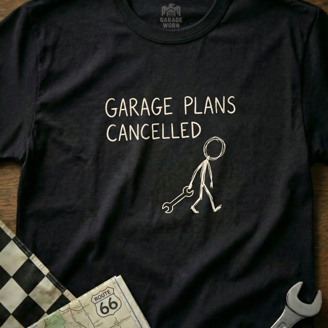Black t-shirt with "Garage Plans Cancelled" and a stick figure with a wrench.