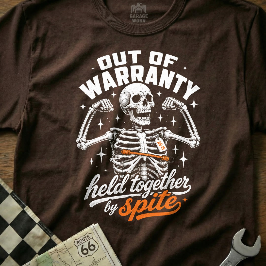 Brown t-shirt with skeleton flexing, "Out of Warranty" and "Held Together By Spite" text.