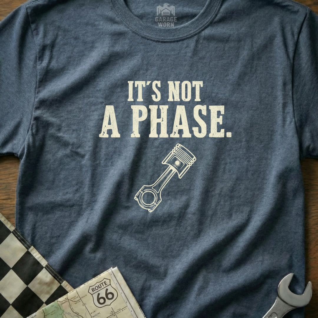 Blue t-shirt with "It's Not A Phase." and piston graphic.