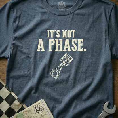 Blue t-shirt with "It's Not A Phase." and piston graphic.
