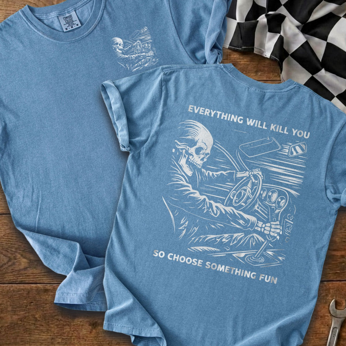Blue t-shirt with a skeleton driving, "Everything Will Kill You" text, and "So Choose Something Fun."