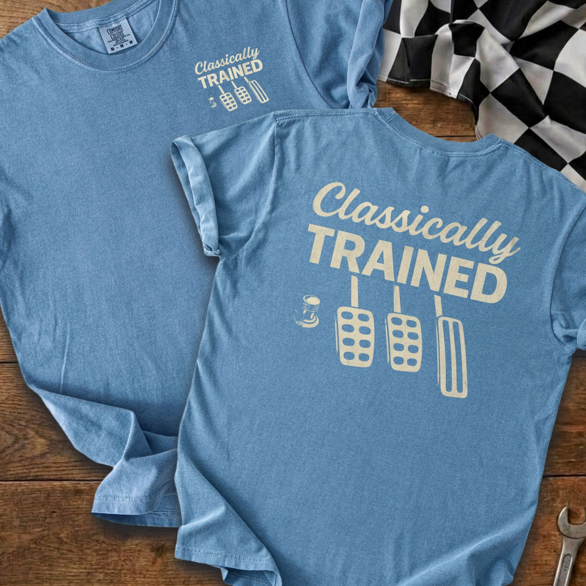 Light blue t-shirt with "Classically Trained" text and pedal graphic.