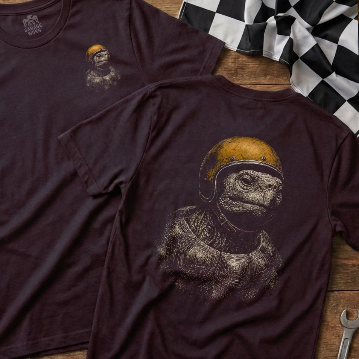 T-shirt with illustration of a tortoise wearing a yellow helmet and racing gear.