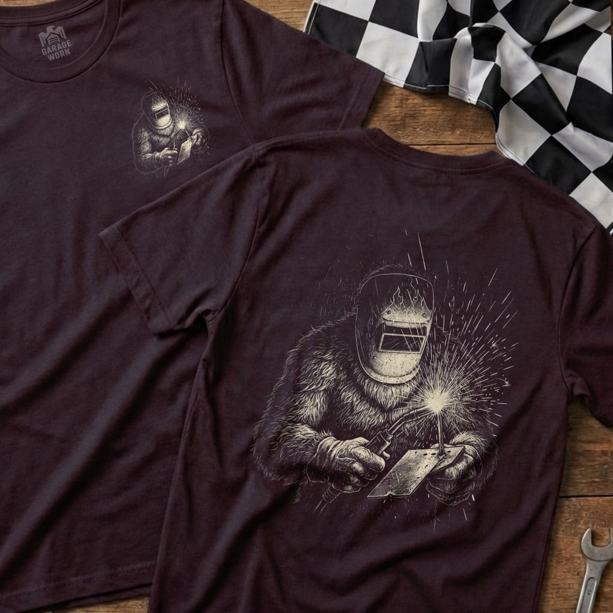 T-shirt with a stylized drawing of a Bigfoot welding.