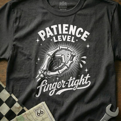 Dark t-shirt with skeleton hand holding bolt, text reads "Patience Level Finger-tight".