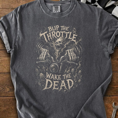 Distressed graphic t-shirt with "Blip The Throttle Wake The Dead" text and skull illustration.
