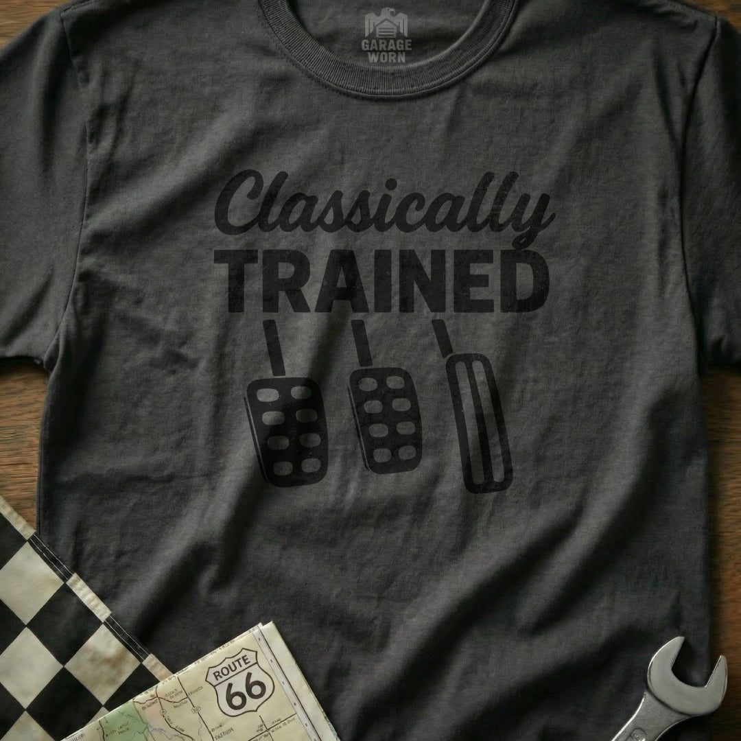 Dark t-shirt with "Classically TRAINED" text and three pedals graphic.