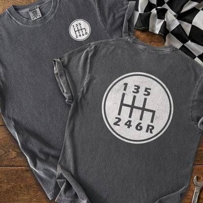 Dark gray t-shirts with a white manual gear shift pattern and numbers 1-3-5 and 2-4-6-R.