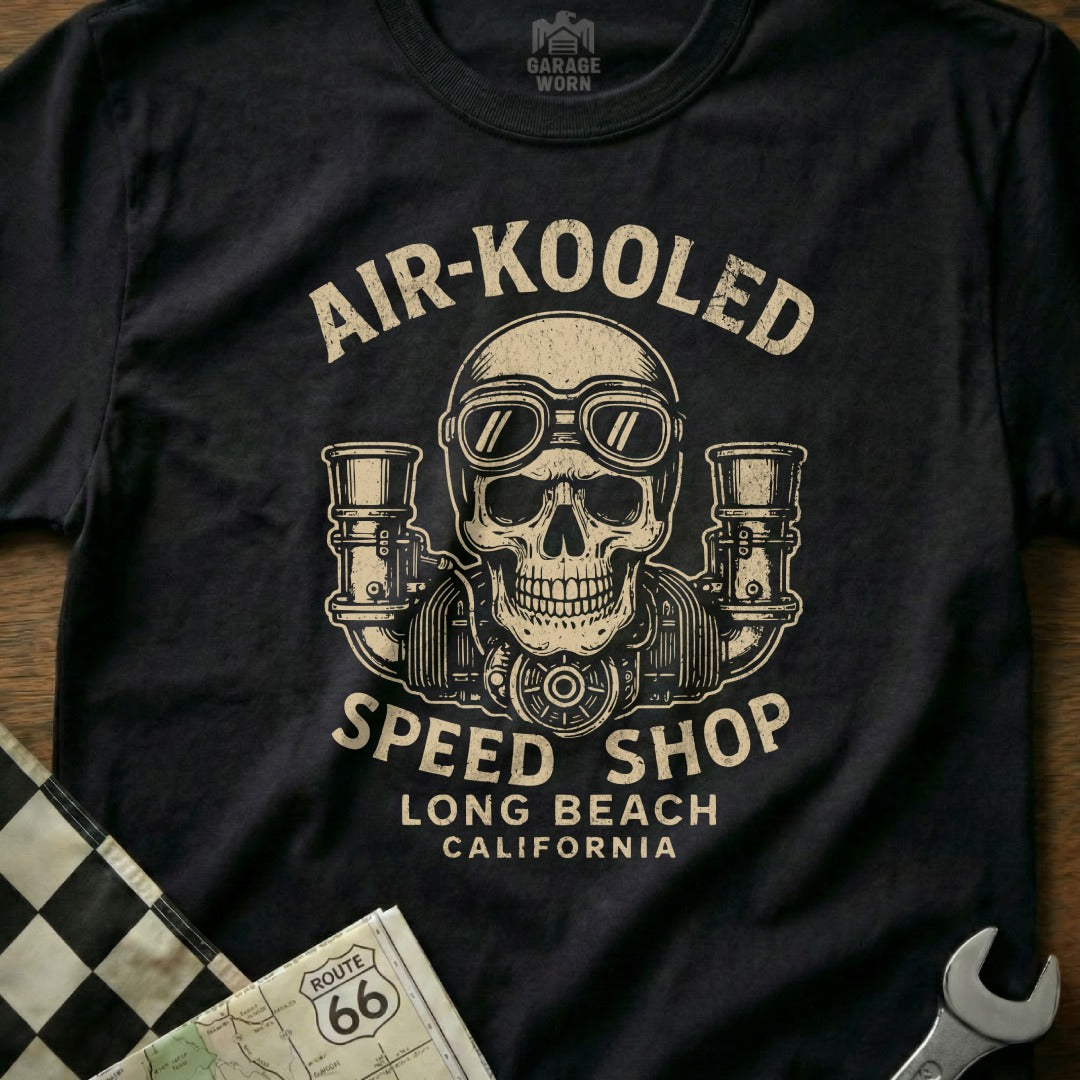 Black t-shirt with a vintage graphic of a skull with goggles and "Air-Kooled Speed Shop" text.
