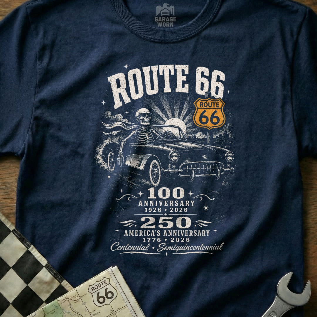 Navy t-shirt with skeleton driving classic car, Route 66 logo, and anniversary dates.