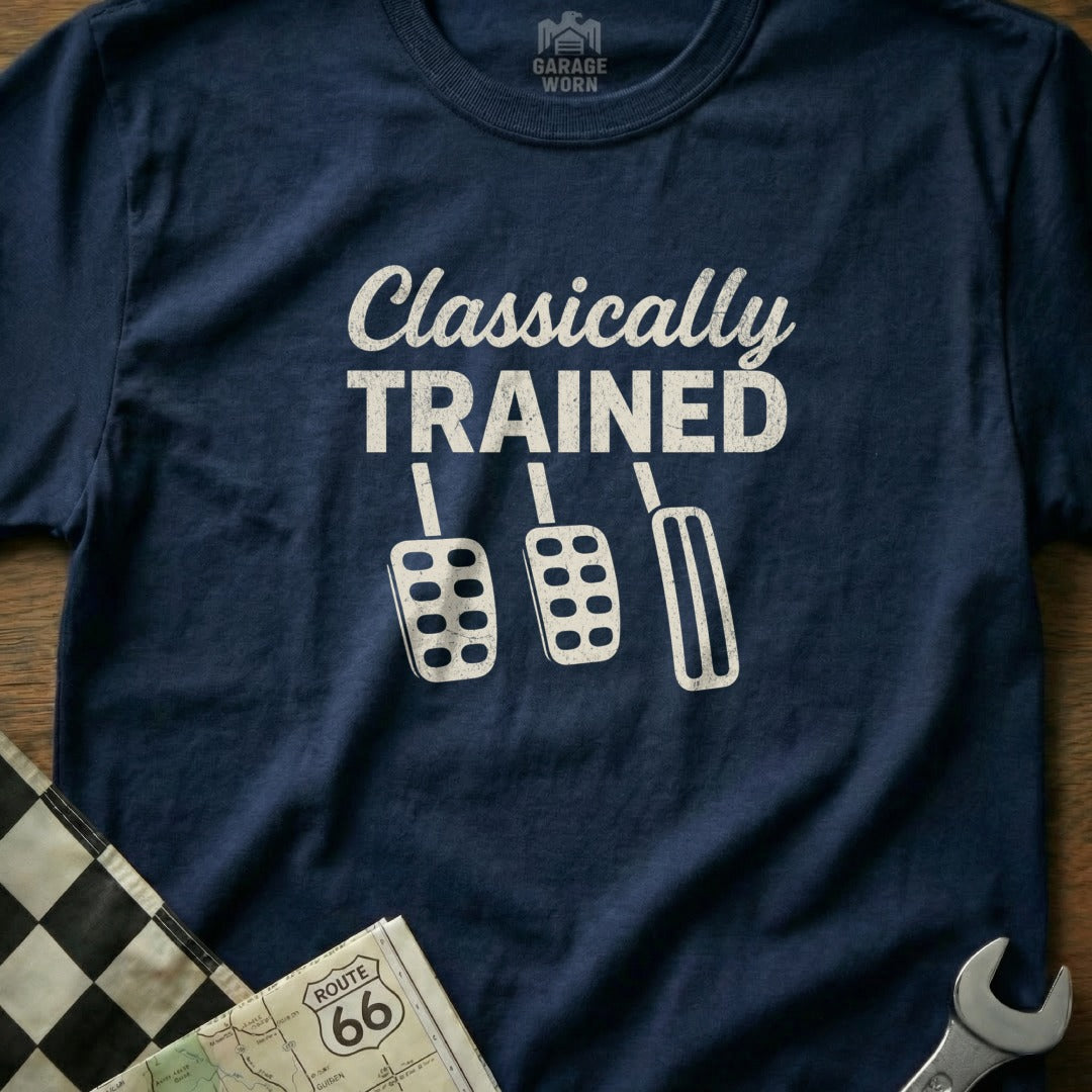 Navy t-shirt with white text "Classically Trained" and three pedals.