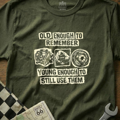 Olive green t-shirt with text and graphics about remembering and using car parts.