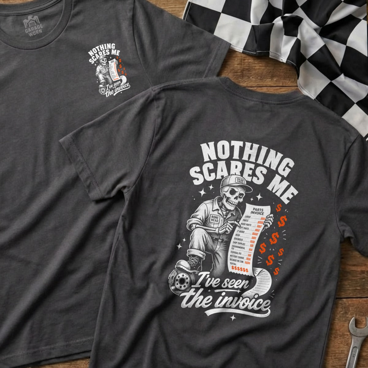 Dark gray t-shirt with skeleton holding an invoice that reads "Nothing scares me. I've seen the invoice."