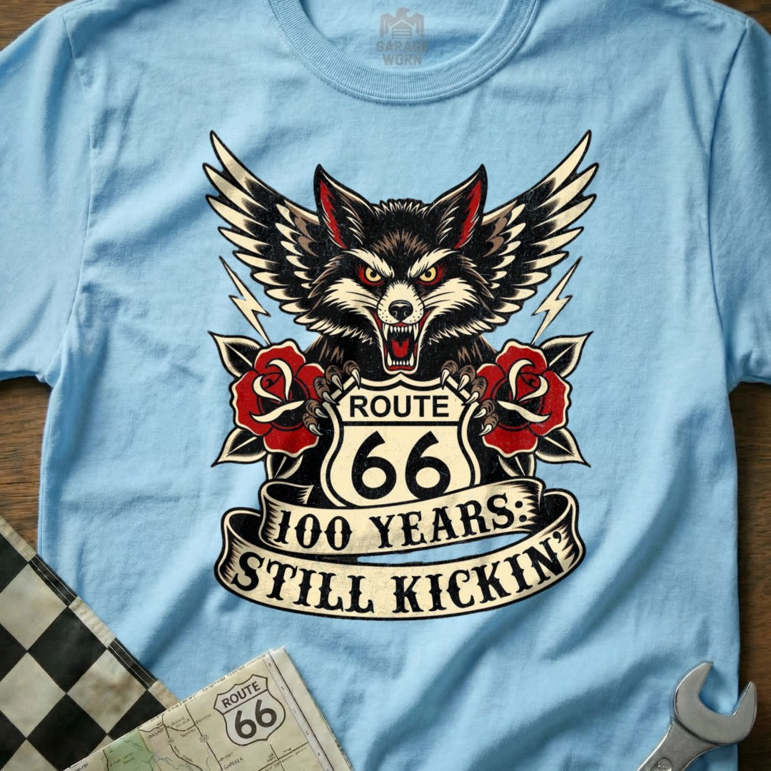Light blue t-shirt with a Route 66 wolf graphic, wings, and banner.