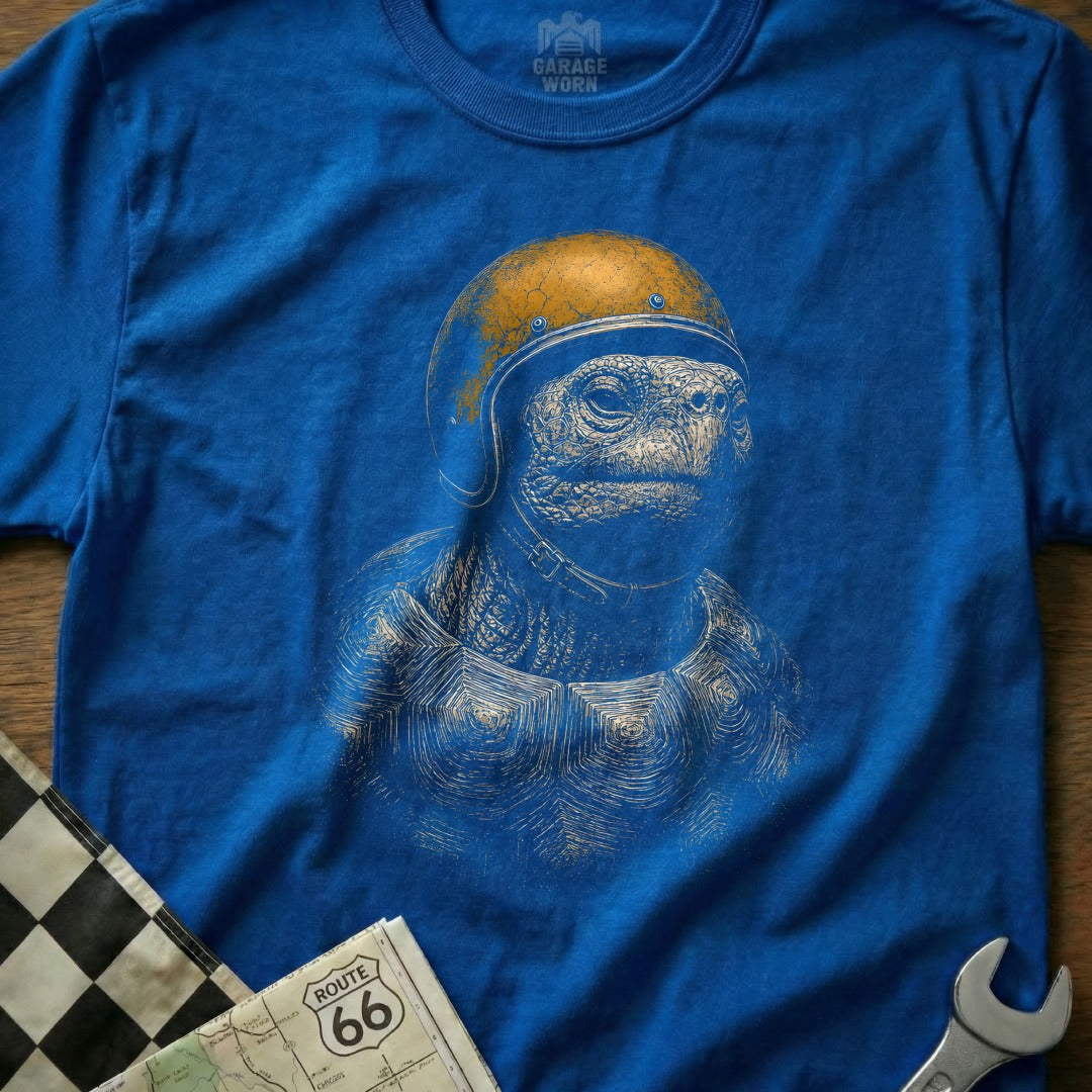 Blue t-shirt with illustration of a tortoise wearing a retro helmet.