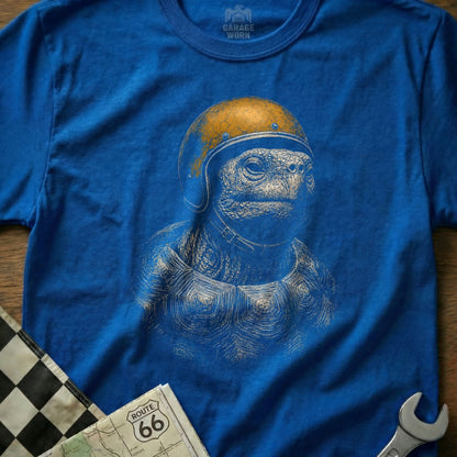 Blue t-shirt with illustration of a tortoise wearing a retro helmet.
