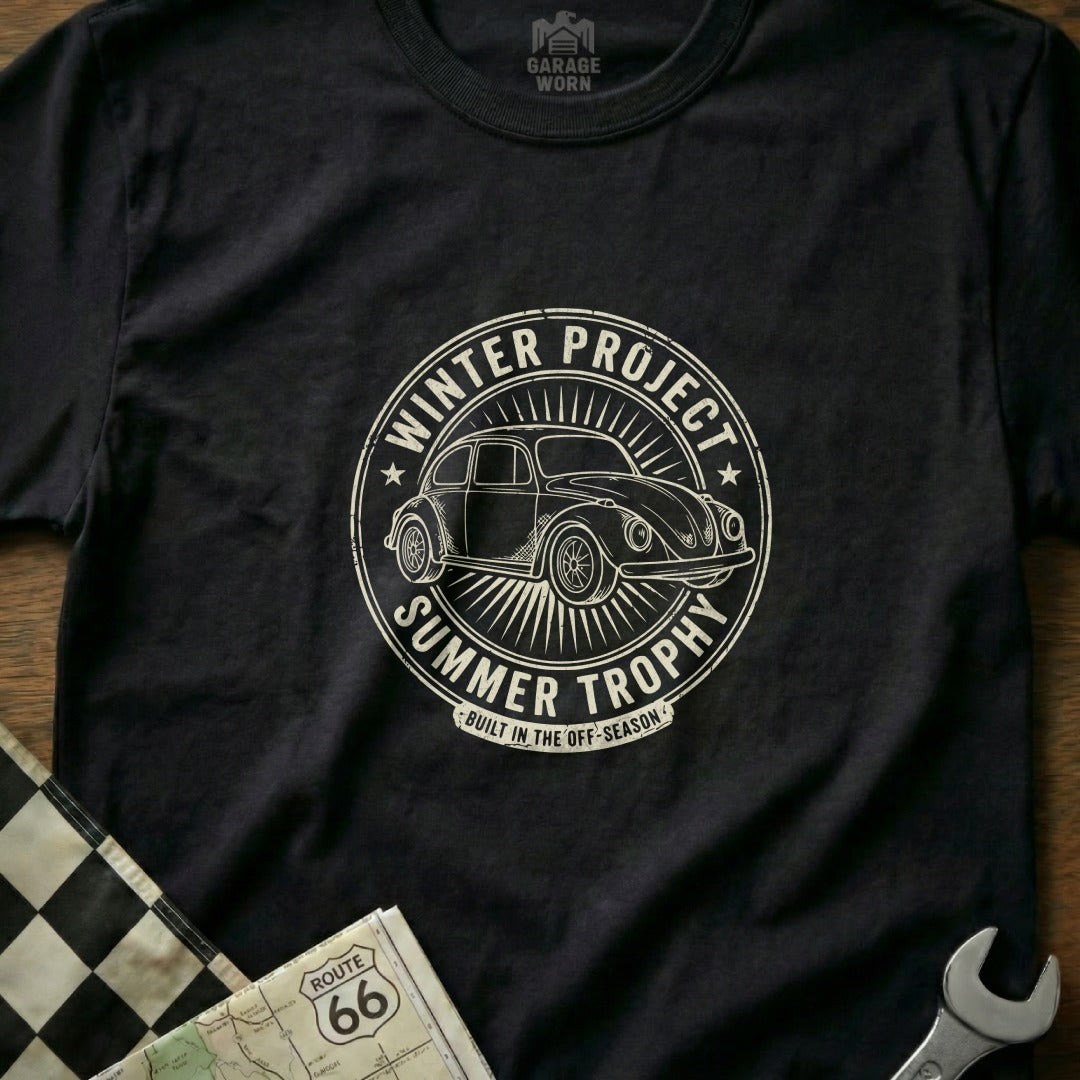 T-shirt with circular graphic of a Volkswagen Beetle, "Winter Project Summer Trophy."