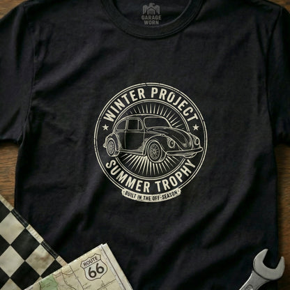 T-shirt with circular graphic of a Volkswagen Beetle, "Winter Project Summer Trophy."